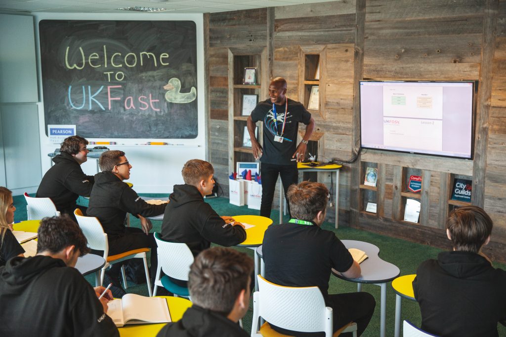 Aaron Saxton with apprentices at UKFast headquarters